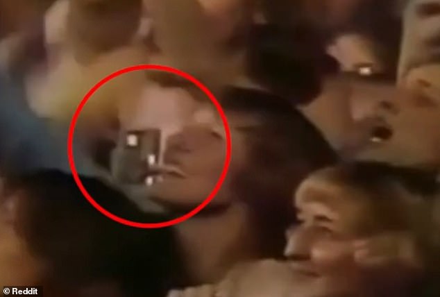 Footage from Elvis Presley's final concert has resurfaced online and appears to show someone carrying a device which conspiracy theorists claim is a smartphone
