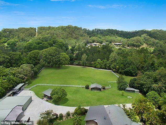 The reported purchase has become the talk of Currumbin Valley, where locals have noticed new screening trees planted along the rear boundary beside Currumbin Creek, apparently shielding the estate from prying eyes