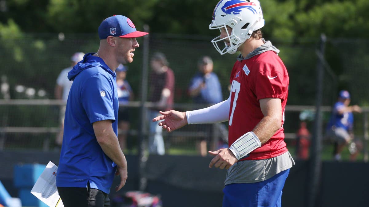 bills-quarterback-josh-allen-talks-with-offensive-coordinator-joe-brady-during-drills-on-day-three-of-the-buffalo-bills-training