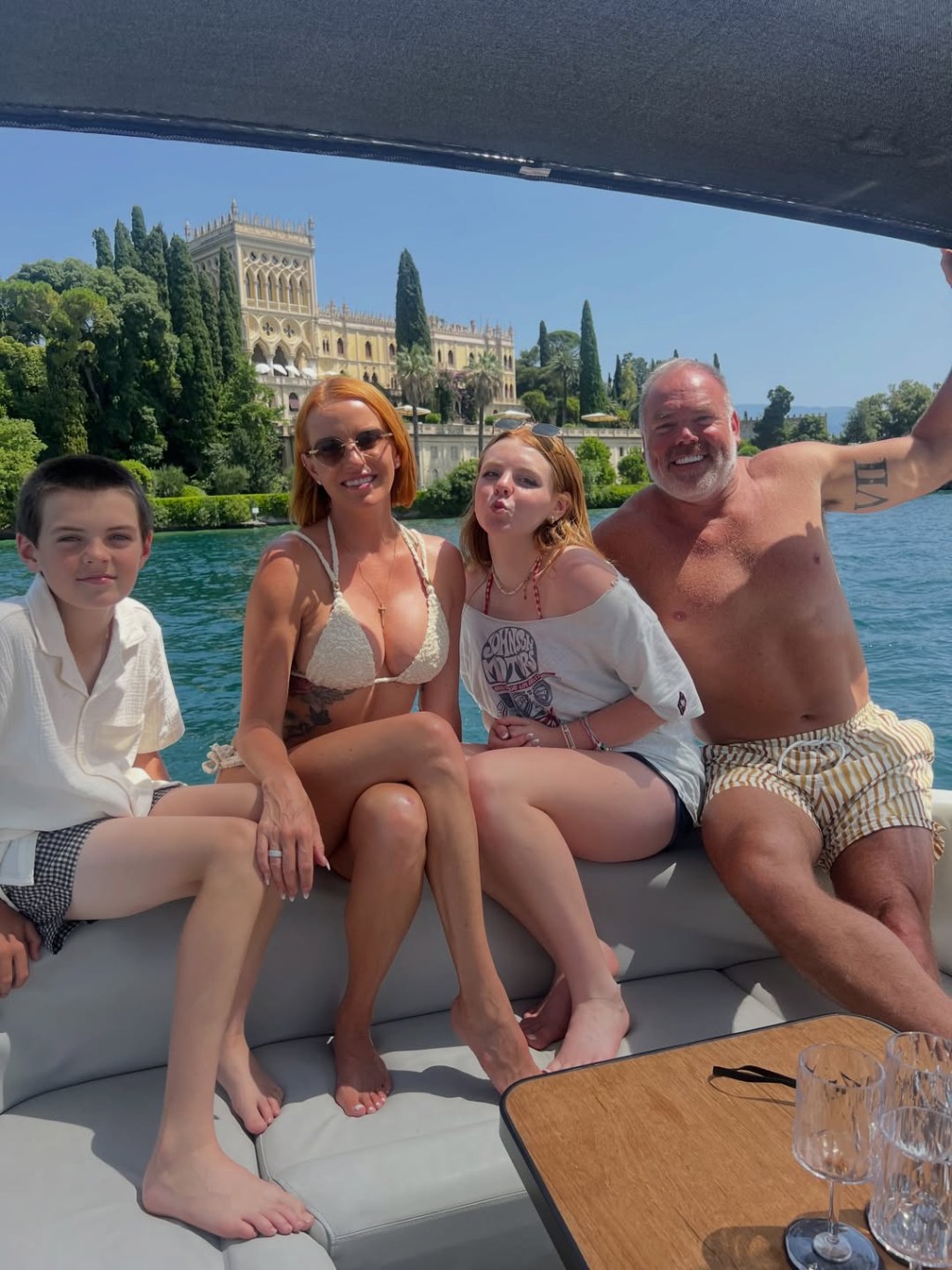 Whtiney and Justin Rose with their children on a boat.