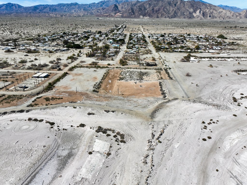 An Aerial UAV Drone View of the West Coast of the Salton Sea Near Thermal, California, Showing the Evaporated Salts from the Water and the abandoned Marina with the Infrastructure Seen in the Salt