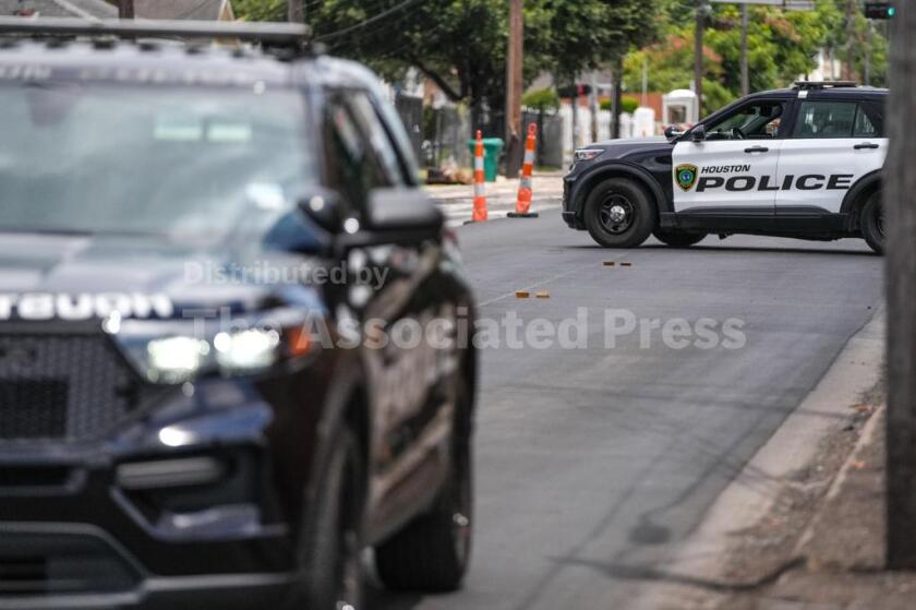 Police work on Canal Street in Houston.