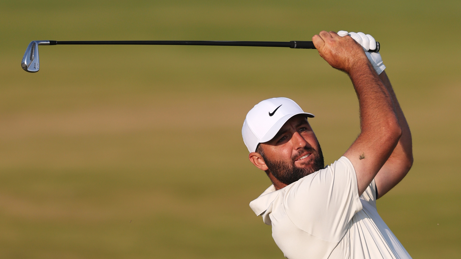 Scottie Scheffler hits a shot in to the green