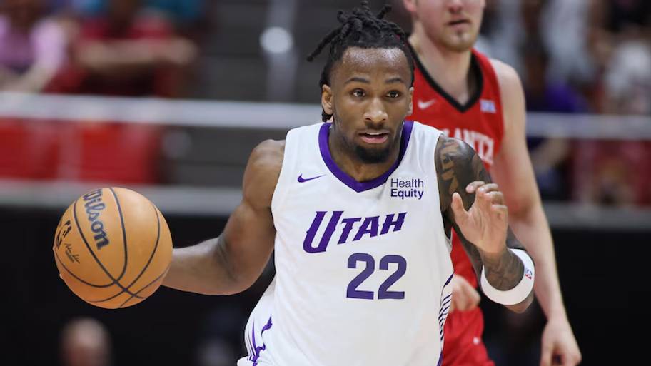 Utah Jazz guard Darryn Peterson dribbles the ball against the Houston Rockets in summer league.