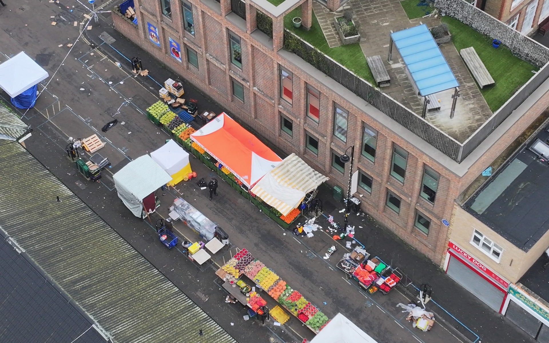 Police were called after receiving reports a man armed with a 'large knife' had charged through a market in south east London