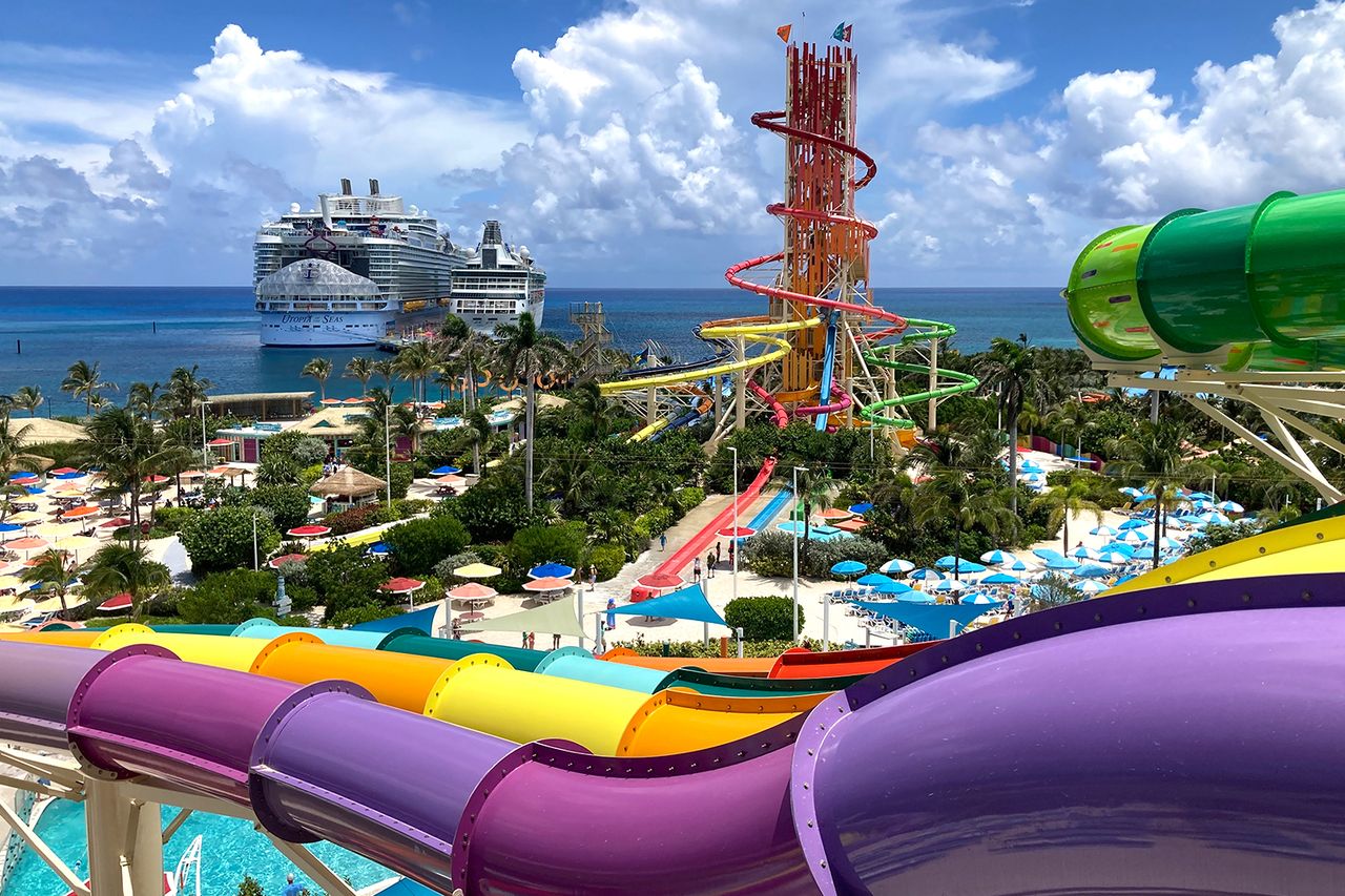 Royal Caribbean's Utopia of the Seas dwarfs the older cruise ship Vision of the Seas as both are seen docked at Perfect Day at CocoCay