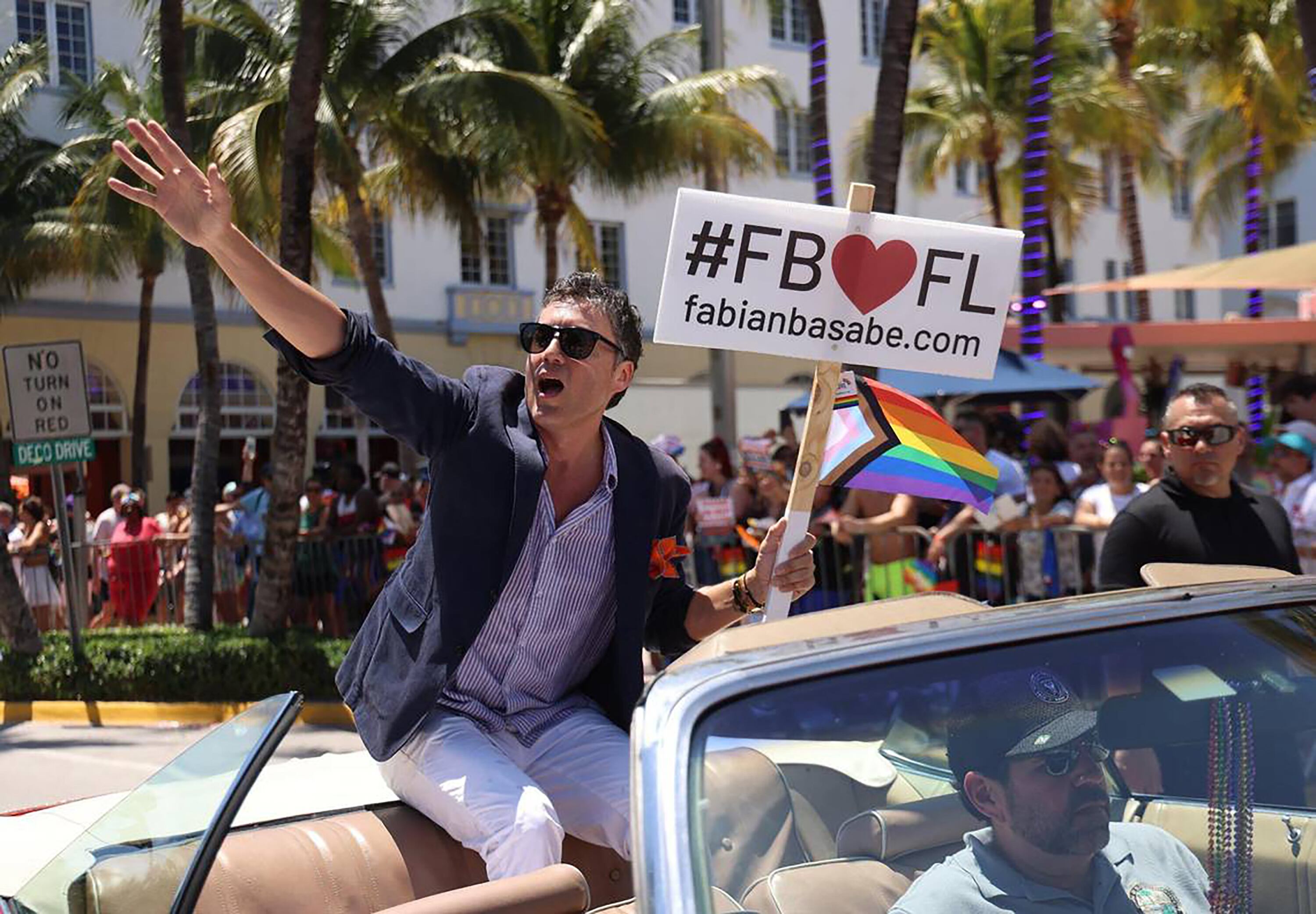 State Rep. Fabian Basabe waves to the crowd during the Miami Beach Pride Parade on April 16, 2023. / Miami Herald / Carl Juste, Getty Images
