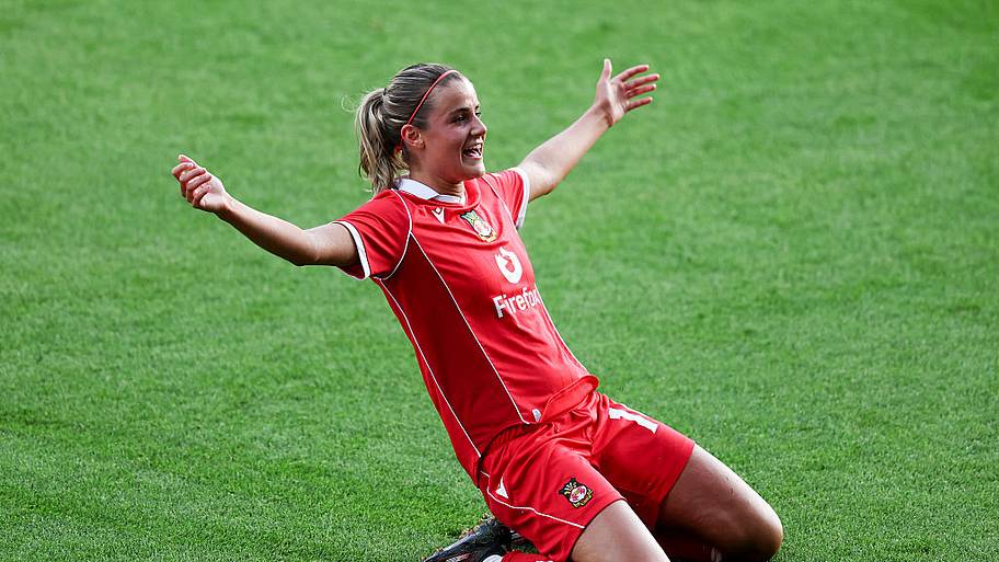 Ava Suckley of AFC Wrexham celebrates scoring her team's third goal.