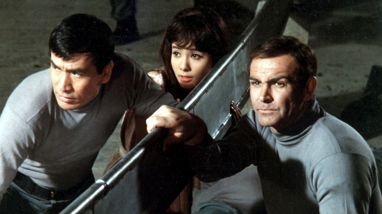 Tiger Tanaka, Kissy Suzuki, and James Bond plan their attack in "You Only Live Twice" (1967)