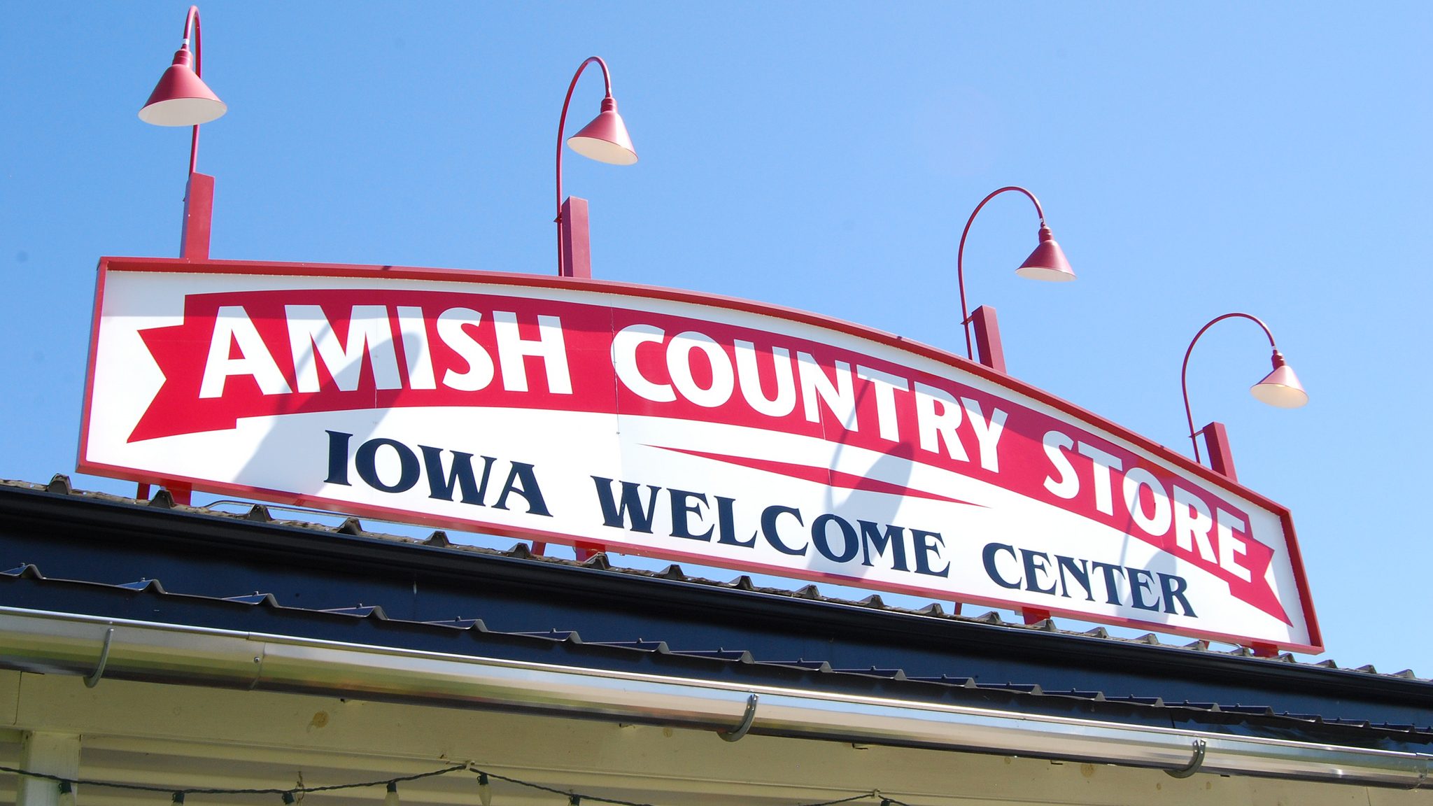 exterior of the sign for the Amish Country Store and Iowa Welcome Center in Lamoni, Iowa
