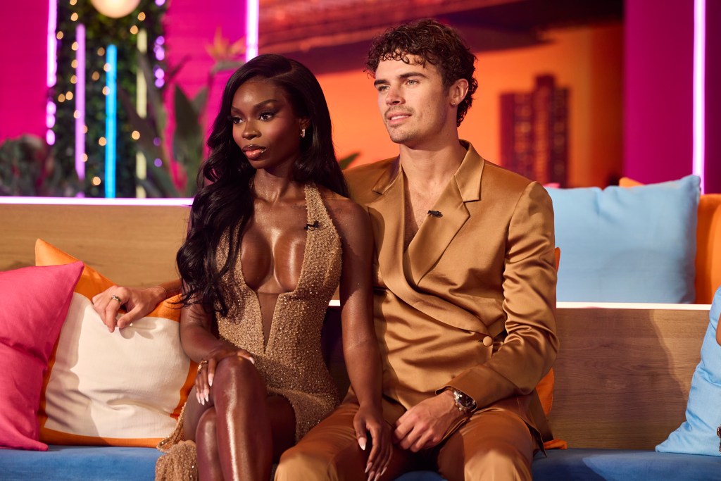 Olandria Carthen and Nicolas Vansteenberghe seated on a couch during the