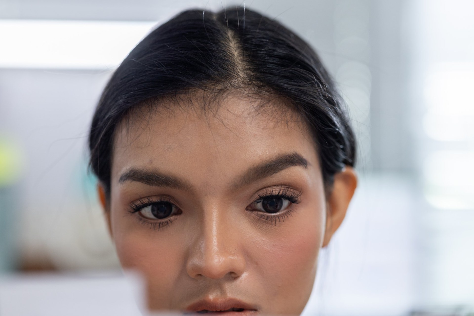 Focused young woman in bright room