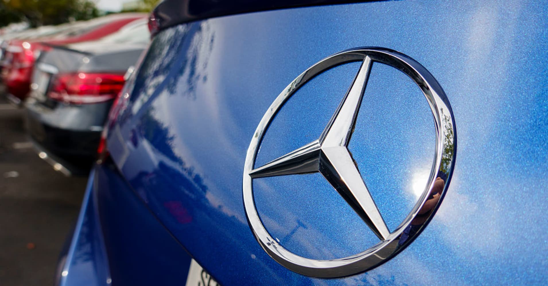 A Mercedes-Benz logo is displayed on a used vehicle for sale at a dealership on November 11, 2025 in San Diego, CA.
