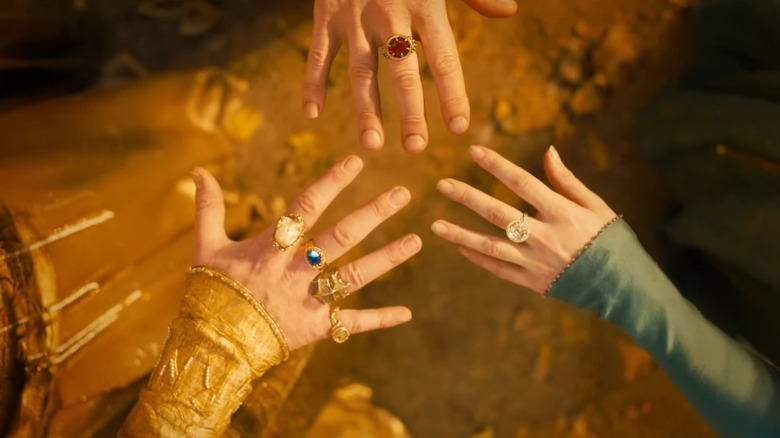 The Three Elven Rings on hands in "The Rings of Power" (2022-present)