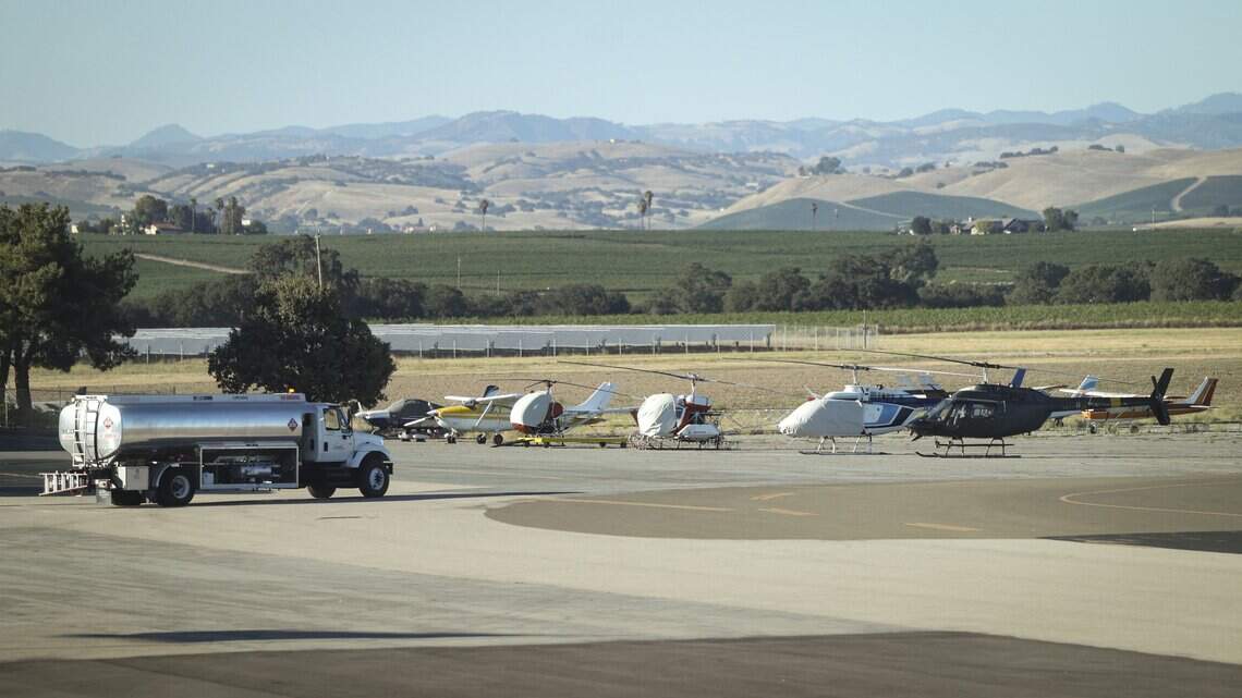Helicopters and fixed wing aircraft in vineyard country at El Paso de Robles Regional Air Terminal, as seen on July 18, 2026. A fuel truck makes deliveries at the facility.