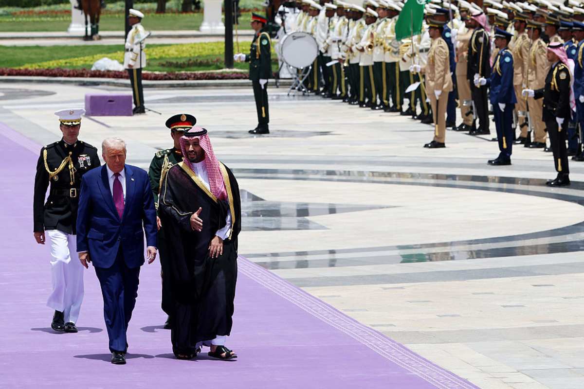 U.S. President Donald Trump walks with Saudi Crown Prince Mohammed bin Salman during an official state arrival ceremony at the Saudi Royal Court on May 13, 2025, in Riyadh, Saudi Arabia. Trump begins a multi-nation tour of the Gulf region focused on expanding economic ties and reinforcing security cooperation with key U.S. allies. (Photo by Win McNamee/Getty Images)