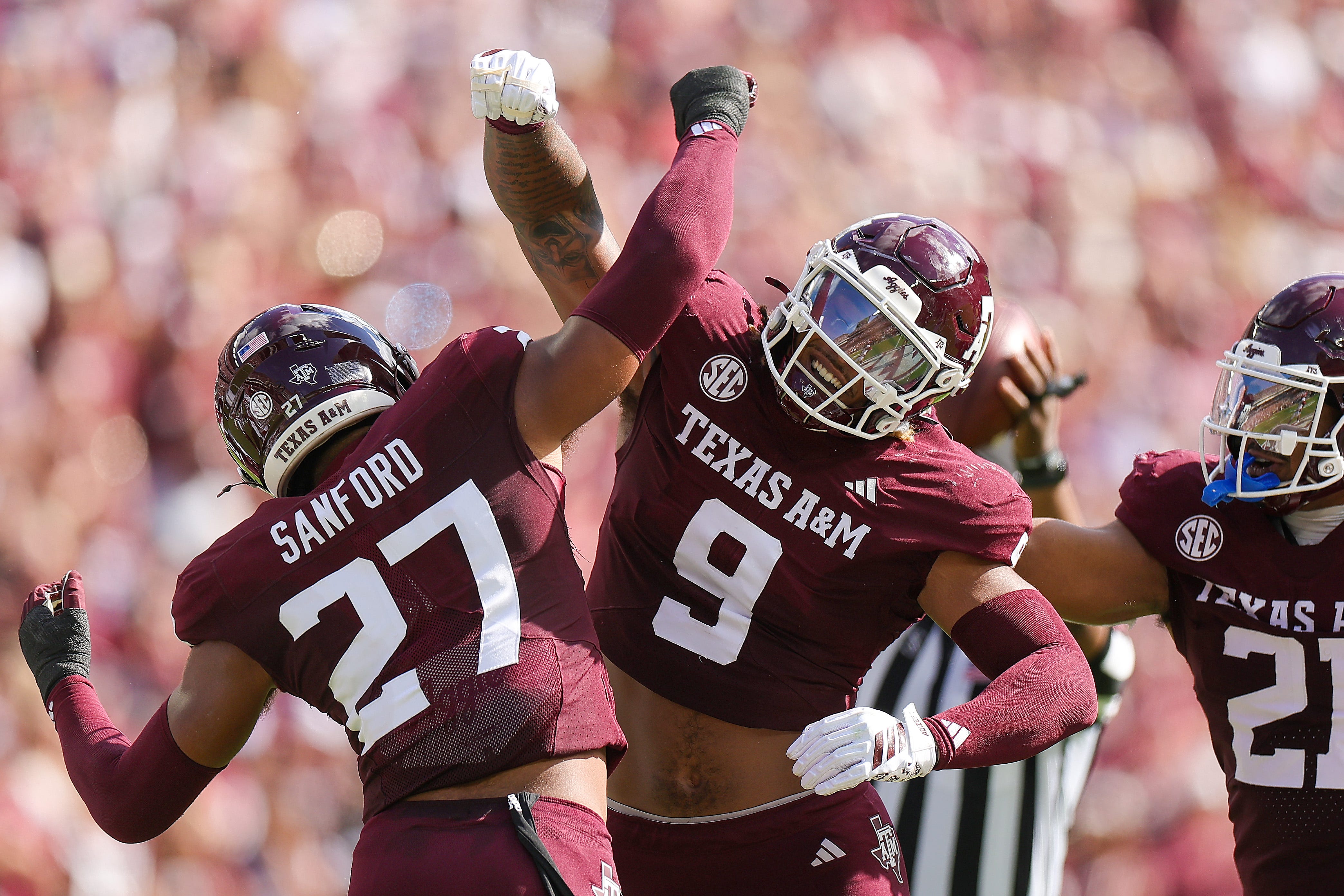 COLLEGE STATION, TEXAS - NOVEMBER 15: Cashius Howell #9 of the Texas A&M Aggies celebrates his deflected pass with teammate Daymion Sanford #27 of the Texas A&M Aggies against the South Carolina Gamecocks during the first quarter at Kyle Field on November 15, 2025 in College Station, Texas. (Photo by Alex Slitz/Getty Images)