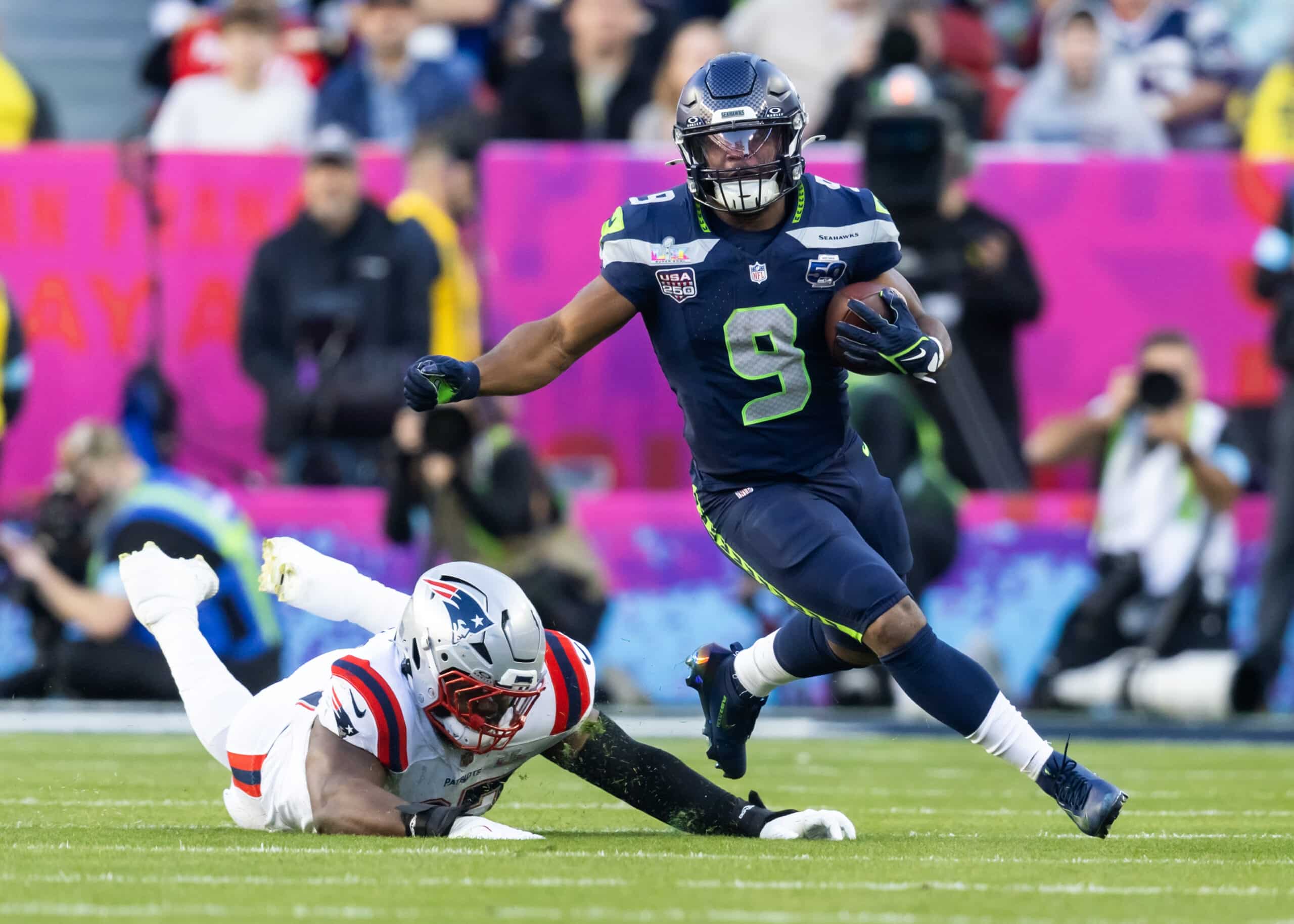 Feb 8, 2026; Santa Clara, CA, USA; Seattle Seahawks running back Kenneth Walker III (9) runs the ball against New England Patriots defensive end Milton Williams (97) during Super Bowl LX at Levi’s Stadium. Mandatory Credit: Mark J. Rebilas-Imagn Images