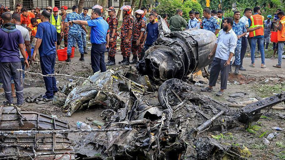 Images from the scene hours after the crash showed scores of emergency service workers sorting through charred rubble