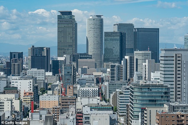 A young woman was killed in Nagoya, Japan after a man who jumped from a 12-story building crashed on top of her - and survived