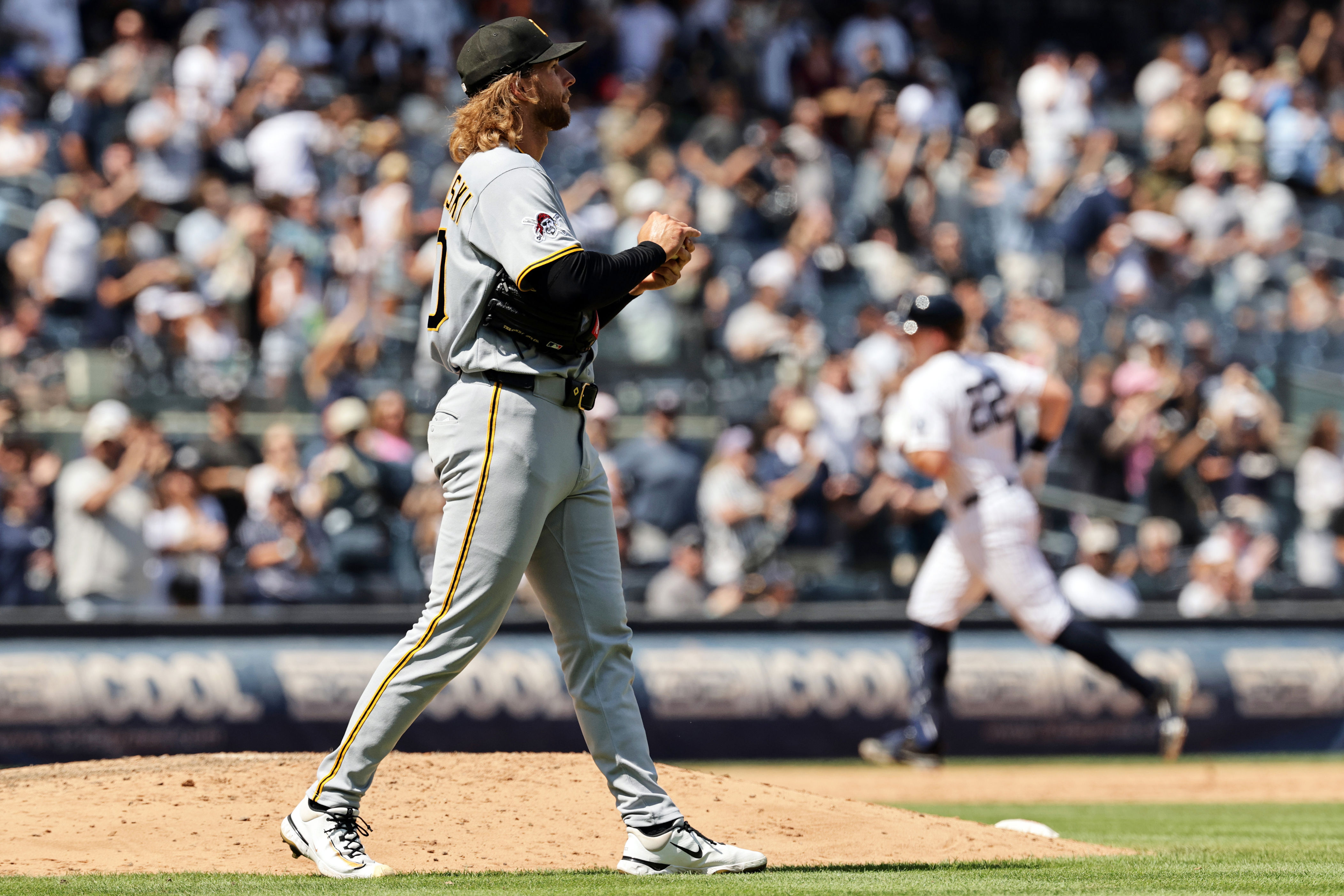 Pittsburgh Pirates pitcher Carmen Mlodzinski reacts after giving up a three-run home run to New York Yankees' Ben Rice in the seventh inning during the first baseball game of a doubleheader, Wednesday, July 22, 2026, in New York. (AP Photo/Adam Hunger)