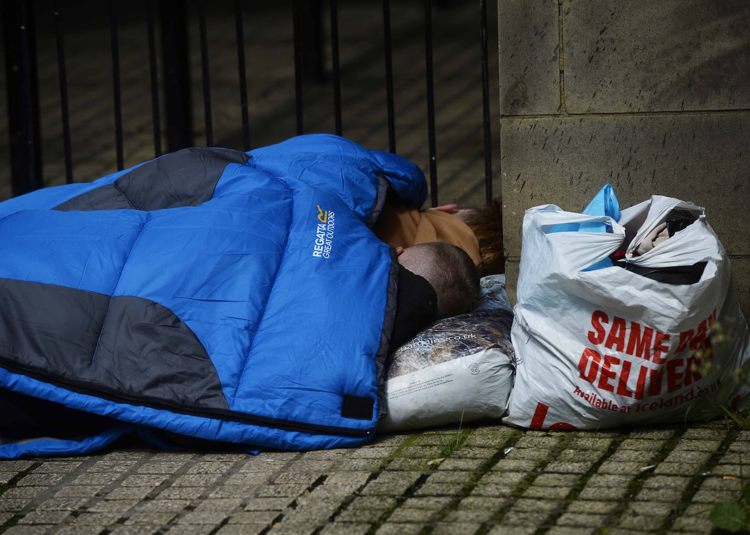 A homeless person sleeping on a Belfast street