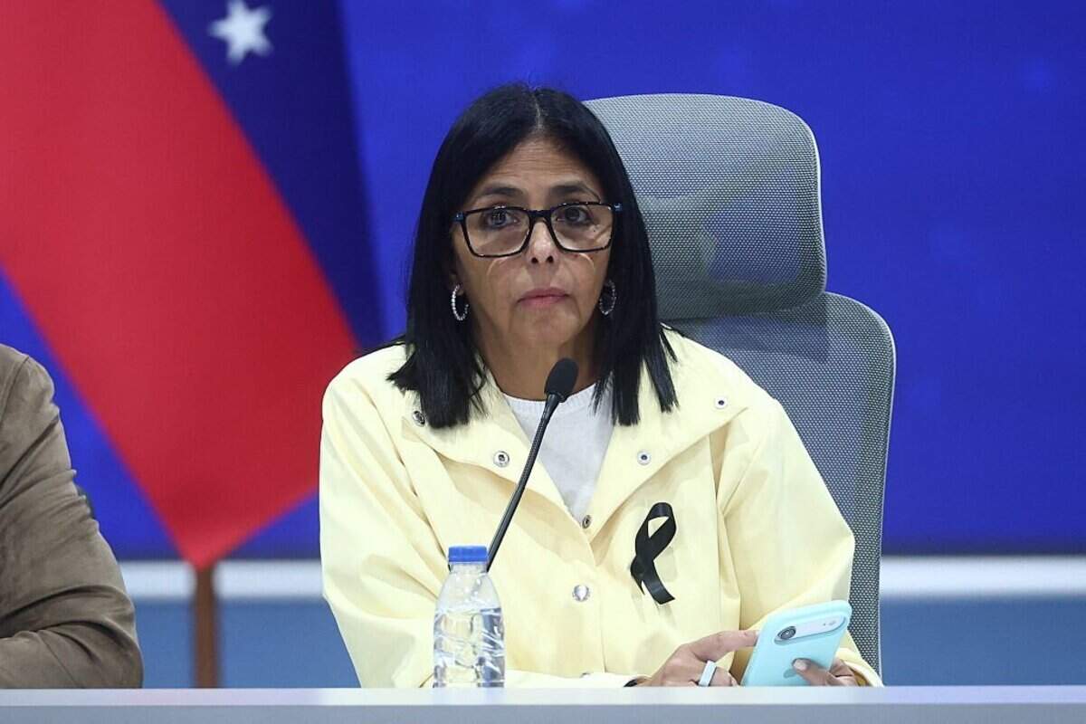Venezuela's interim President Delcy Rodriguez looks on during a press conference at the Generalisimo Francisco de Miranda Air Base in Caracas on July 2, 2026. At least 2,595 people have died as a result of the twin earthquakes that struck Venezuela on June 24, interim President Delcy Rodriguez announced on July 2, adding that all of the victims will be properly identified. (Photo by Lucas AGUAYO / AFP via Getty Images)