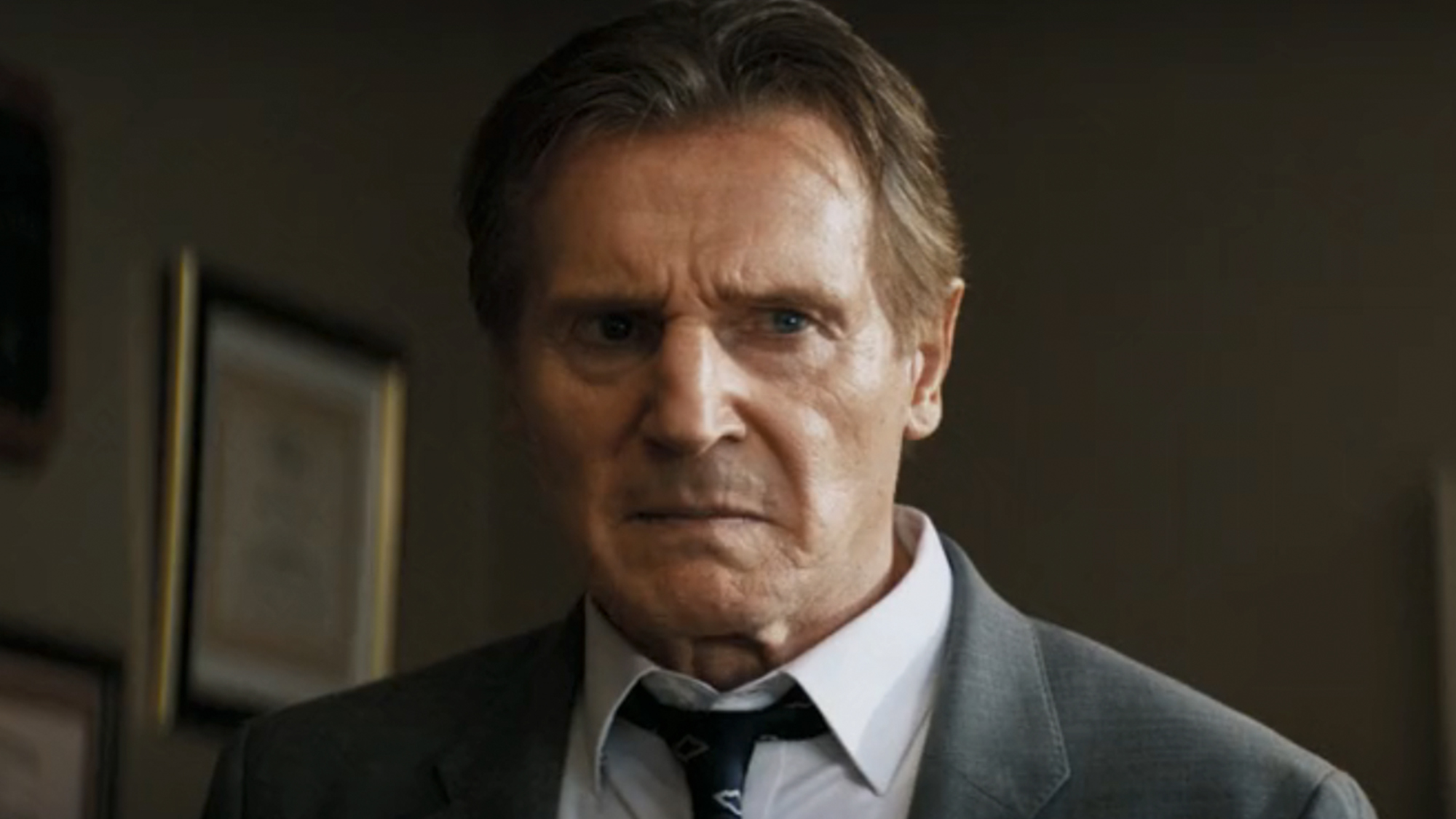 Liam Neeson looking upset in The Naked Gun from 2025