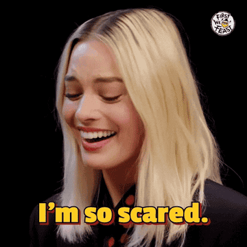 A woman expressing mock fear with the text