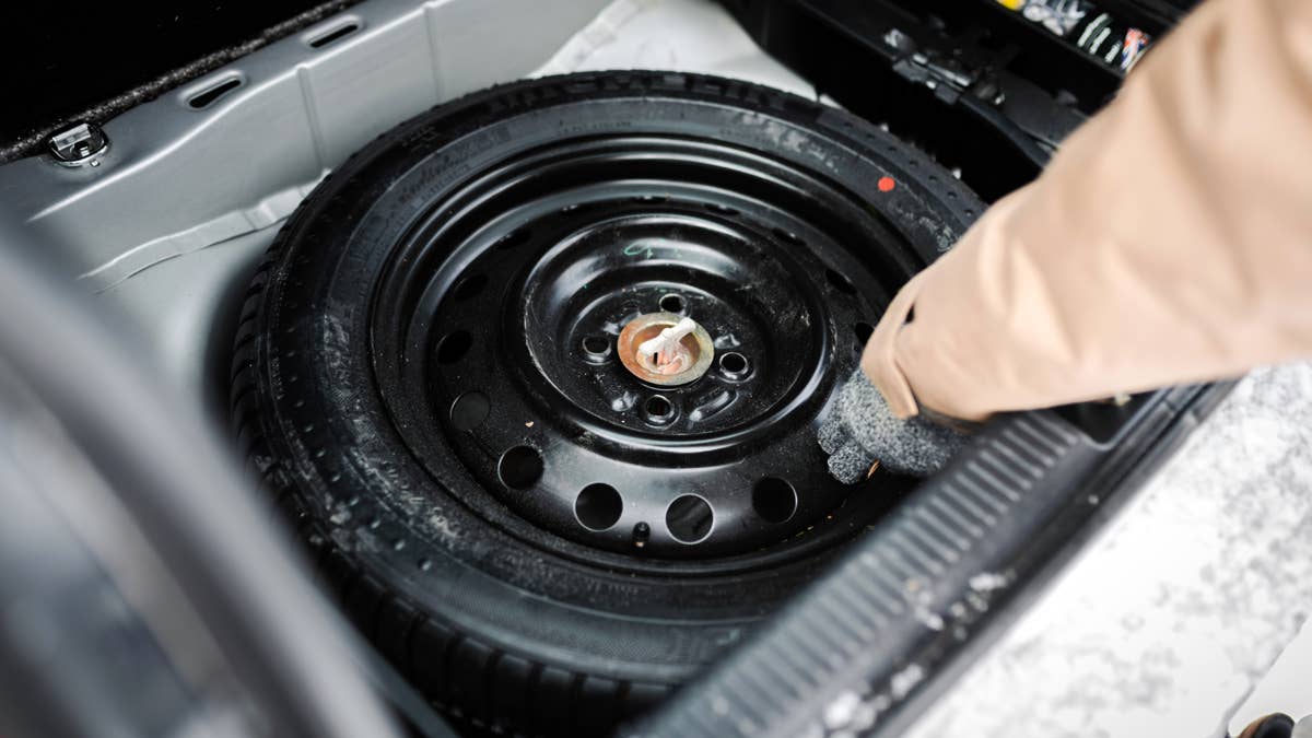 we-have-a-problem-here-spare-tire-in-car-trunk