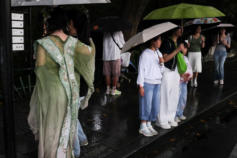 People use umbrellas in the rain in Hangzhou