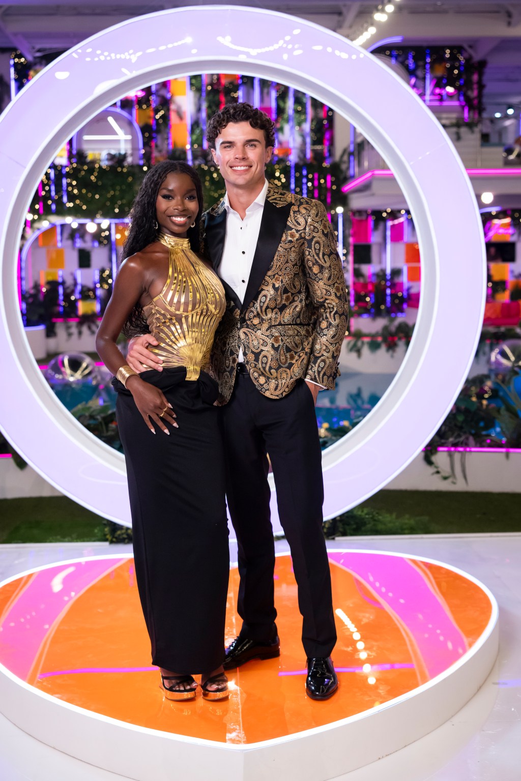 Olandria Carthen and Nicolas Vansteenberghe smiling at the camera at a Love Island event.