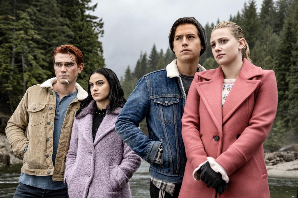 From left, KJ Apa, Camila Mendes, Cole Sprouse, and Lili Reinhart looking out over a river in a scene from