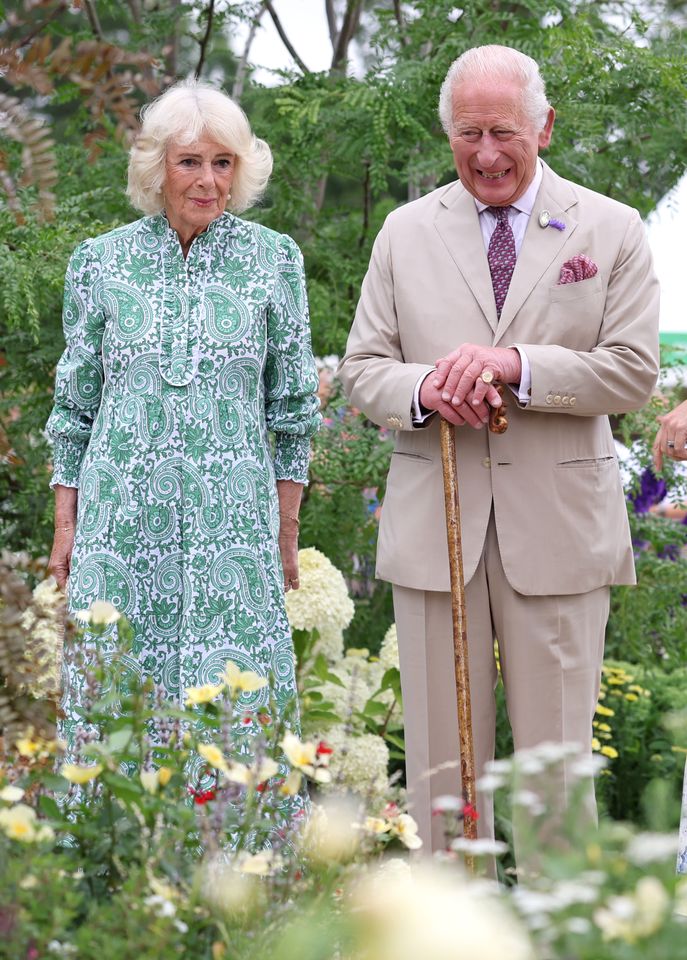 Queen Camilla and King Charles III smile as they visit the Royal Legacy Garden at the first RHS Sandringham Flower Show at Royal Sandringham Estate on July 22, 2026 in Sandringham, Norfolk.