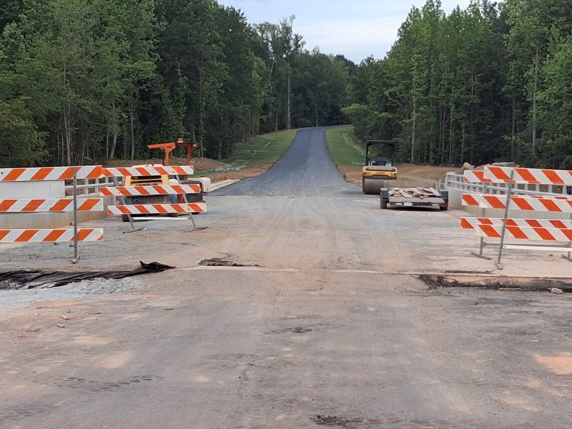 Shown is the southward view toward Huntersville from the McDowell Creek Greenway bridge in Cornelius on the not-yet-open Northcross Drive Extension two-mile road.