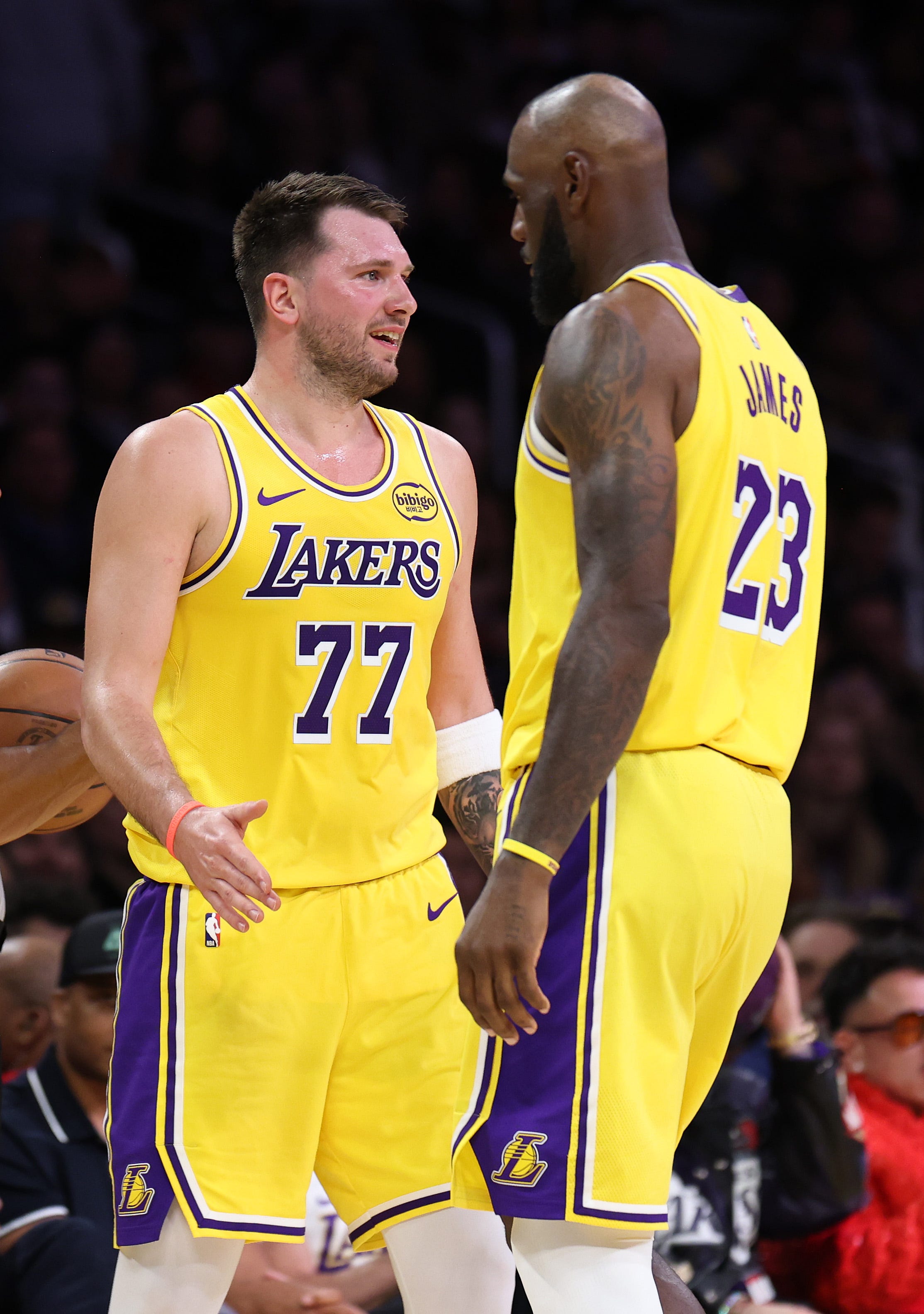LOS ANGELES, CALIFORNIA - FEBRUARY 20: Luka Doncic #77 and LeBron James #23 of the Los Angeles Lakers look on during the first half of their game against the Los Angeles Clippers at Crypto.com Arena on February 20, 2026 in Los Angeles, California. NOTE TO USER: User expressly acknowledges and agrees that, by downloading and or using this photograph, User is consenting to the terms and conditions of the Getty Images License Agreement. (Photo by Luiza Moraes/Getty Images)