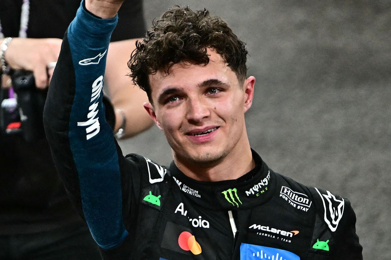 McLaren's British driver Lando Norris celebrates after finishing the race third to win the world championship title at the end of the Abu Dhabi Formula One Grand Prix at the Yas Marina Circuit in Abu Dhabi on December 7, 2025.