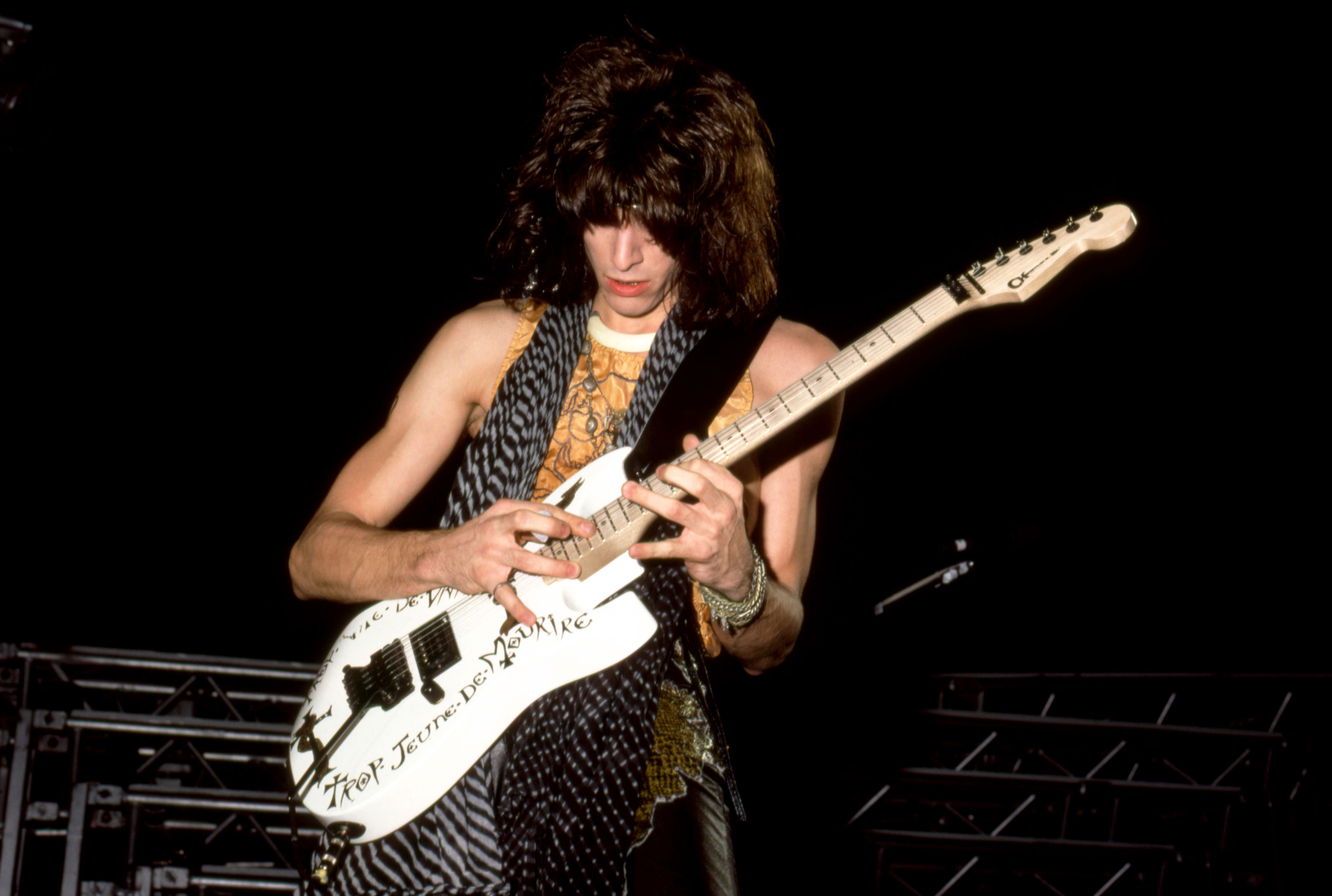 American guitarist Warren DeMartini, of the American glam metal band Ratt, plays on stage during the Invasion of Your Privacy Tour on November 10, 1985 at the Lansing Civic Center in Lansing, Michigan