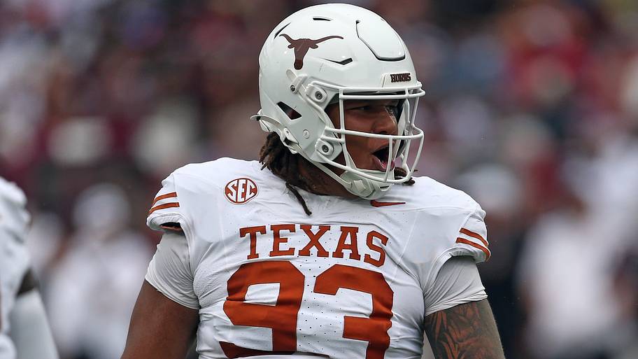 Texas Longhorns defensive linemen Hero Kanu reacts.