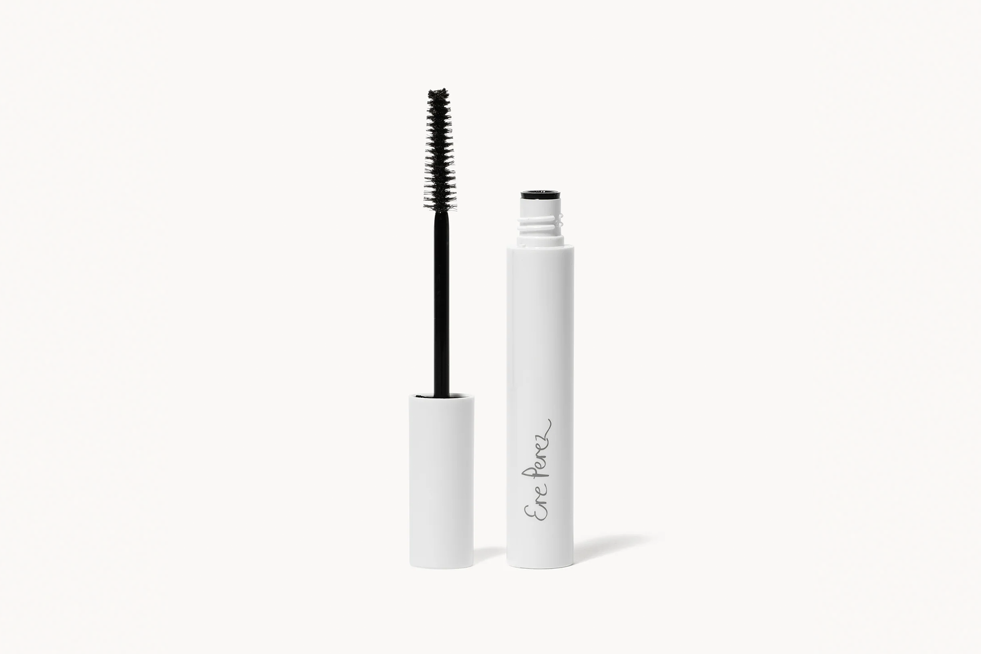 White Ere Perez mascara tube with the brush wand removed.