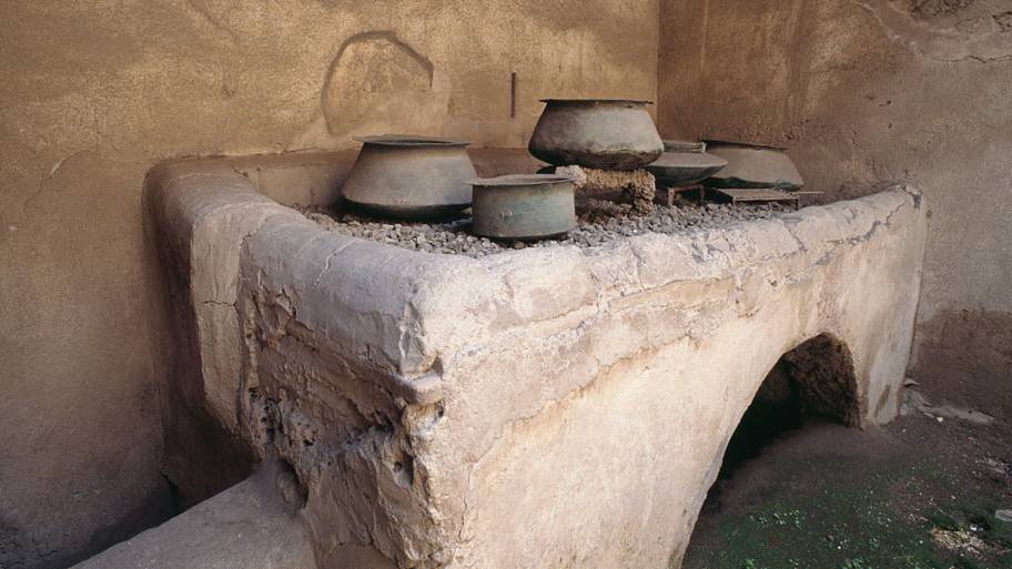 Stonework fireplace in kitchen, Pompeii