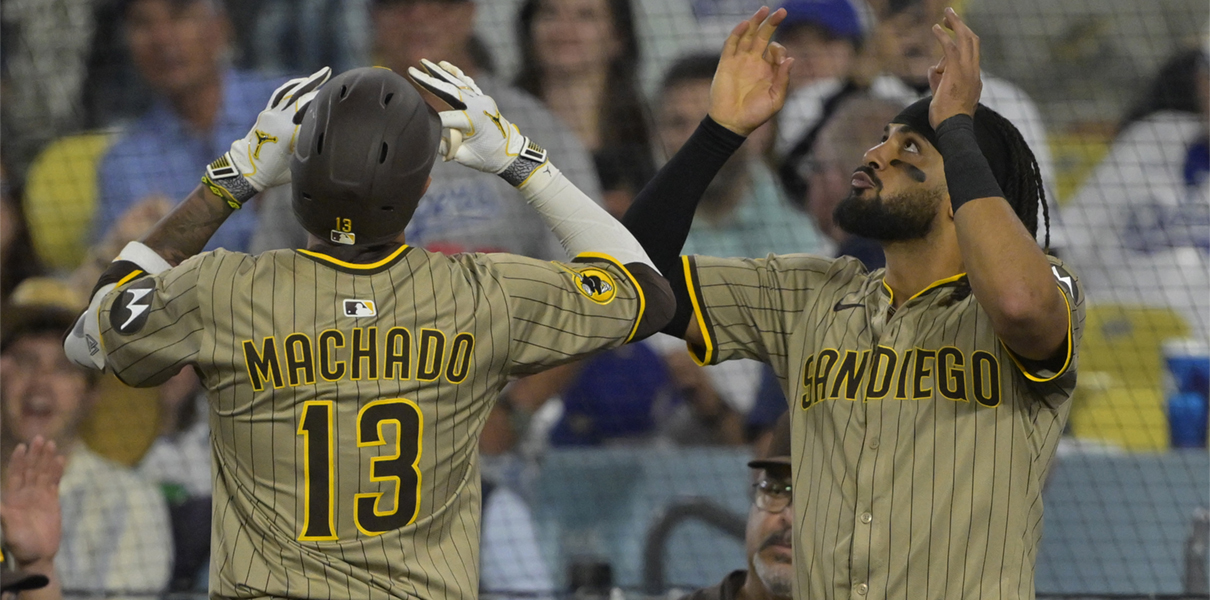 Jun 16, 2025; Los Angeles, California, USA; San Diego Padres third baseman Manny Machado (13) celebrates with right fielder Fernando Tatis Jr. (23) after a solo home run in the sixth inning against the Los Angeles Dodgers at Dodger Stadium. Mandatory Credit: Jayne Kamin-Oncea – Imagn Images