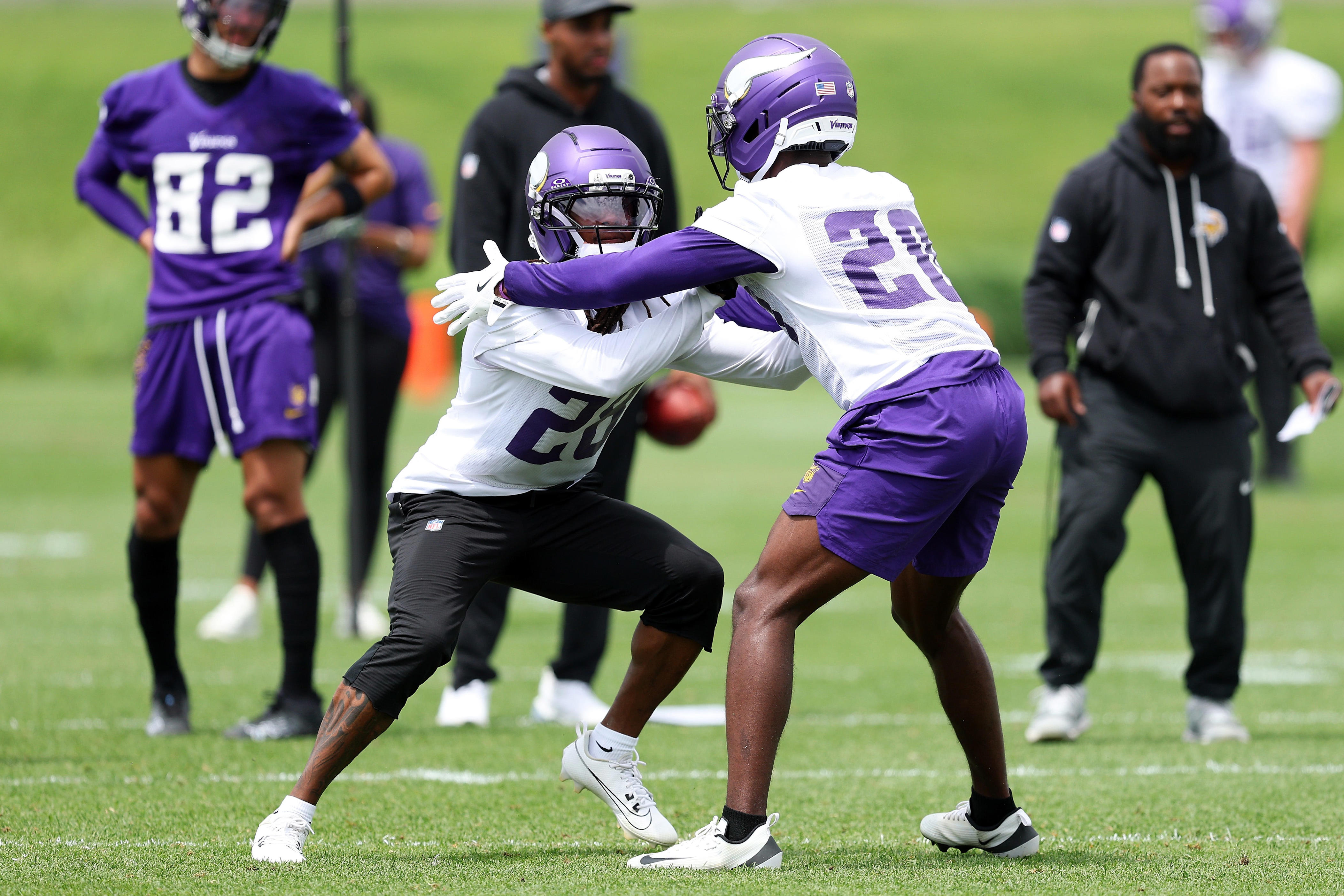 EAGAN, MINNESOTA - JUNE 10: Tyreek Chappell #28 and Charles Demmings #20 of the Minnesota Vikings participate in a drill during minicamp at Twin Cities Orthopedics Performance Center on June 10, 2026 in Eagan, Minnesota. (Photo by David Berding/Getty Images)