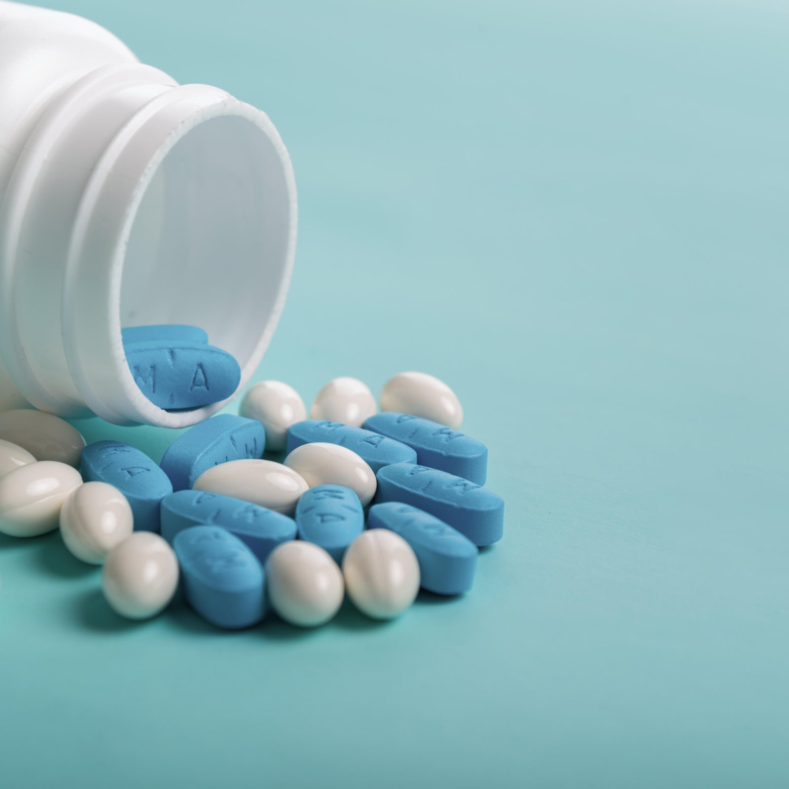 Pills on color background