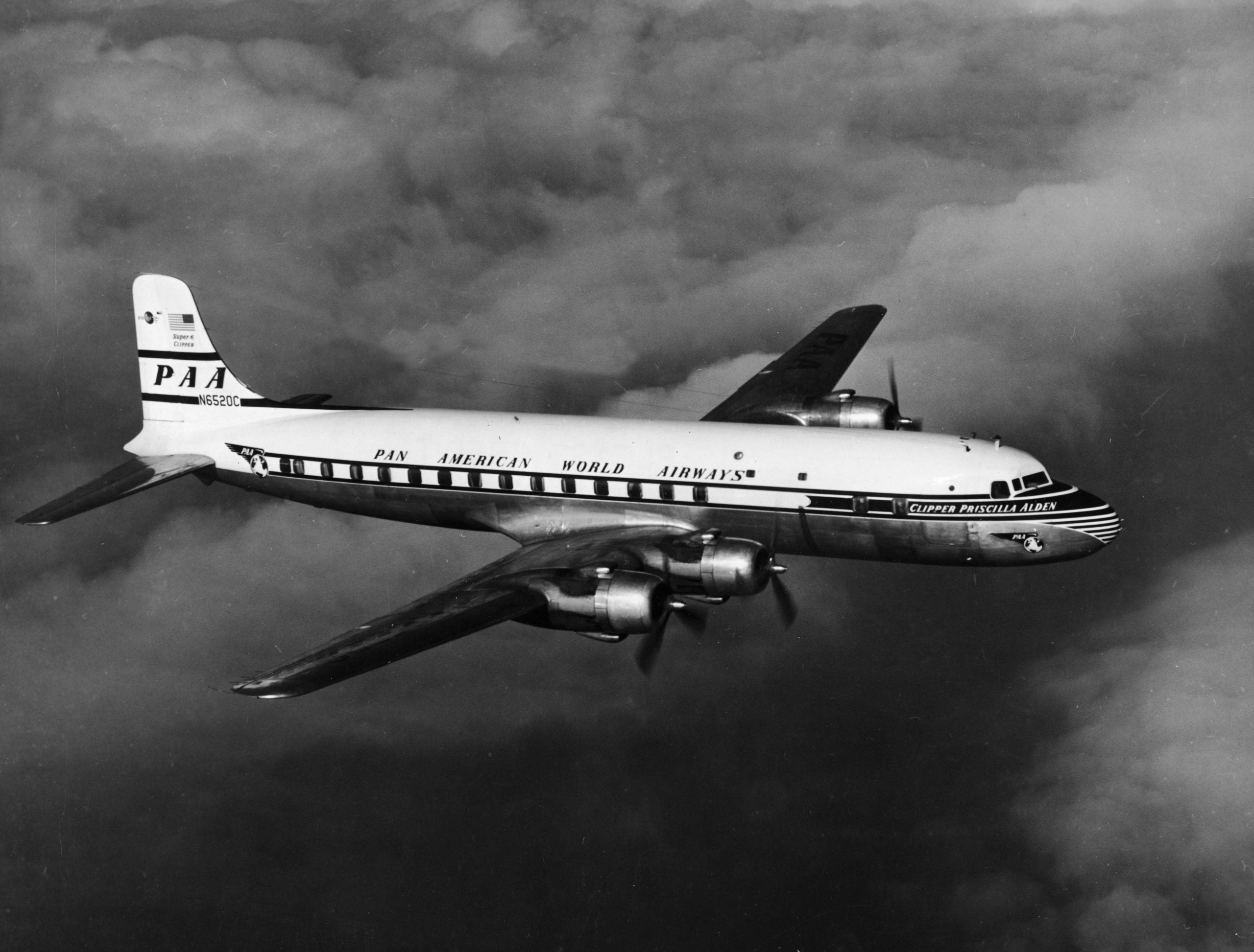Pan American World Airways Super-6 plane the Clipper Priscilla Alden (registration number N6520C) flies over the Atlantic Ocean during one of its earliest runs between hemispheres, 1952.