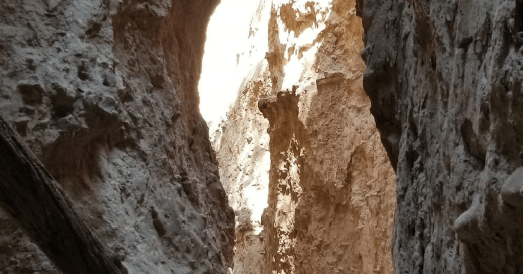 Narrow rocky canyon walls with sunlight at Devil's Den, Nebraska.