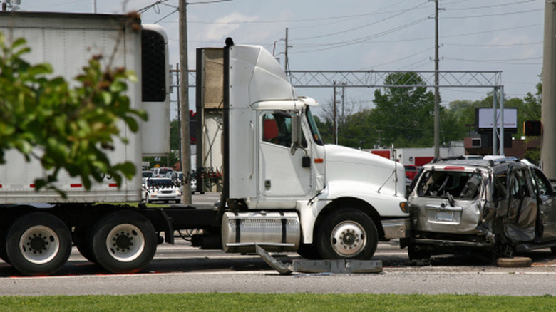 An 18-wheeler crashing into an SUV.