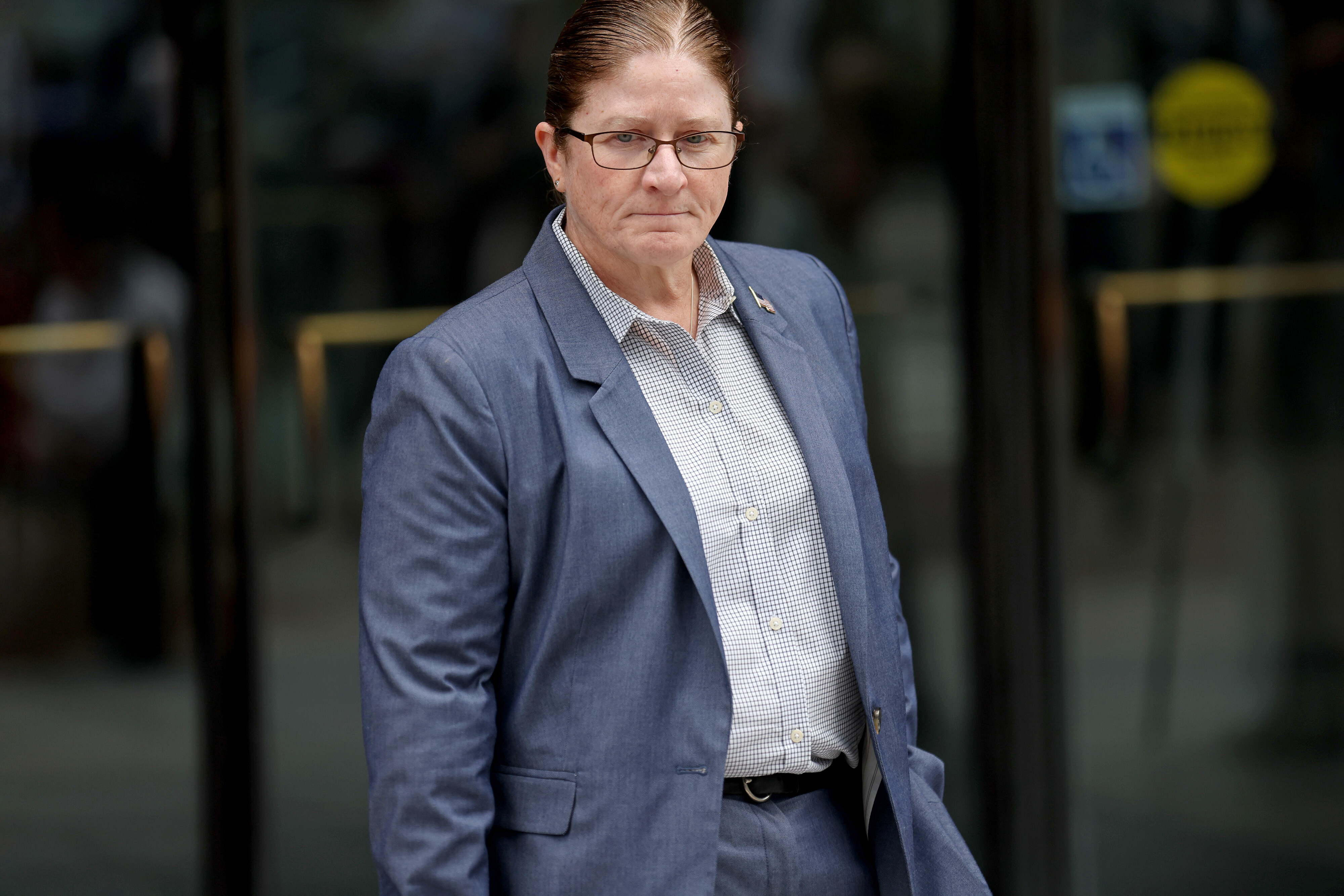 Stoughton Police Chief Donna McNamara leaves the Boston federal courthouse after the arrest of a former Stoughton cop accused of killing Sandra Birchmore.