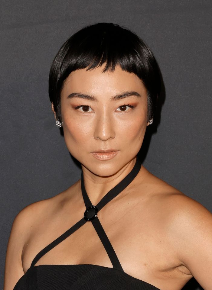 Greta Lee posing at an event
