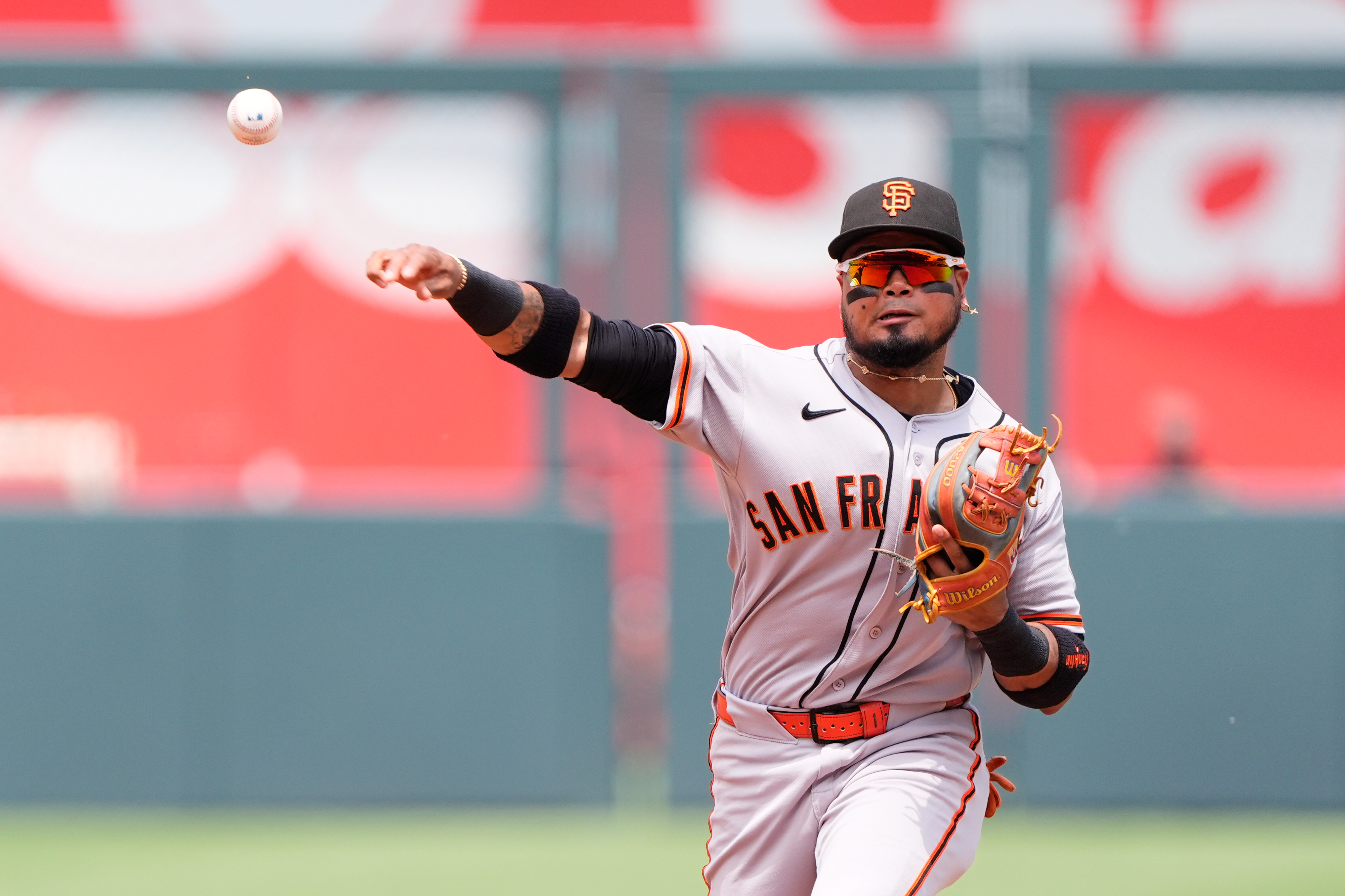 San Francisco Giants second baseman Luis Arraez throws to first for the out on Kansas City Royals' Salvador Perez during the second inning of a baseball game Wednesday, July 22, 2026, in Kansas City, Mo. (AP Photo/Charlie Riedel)